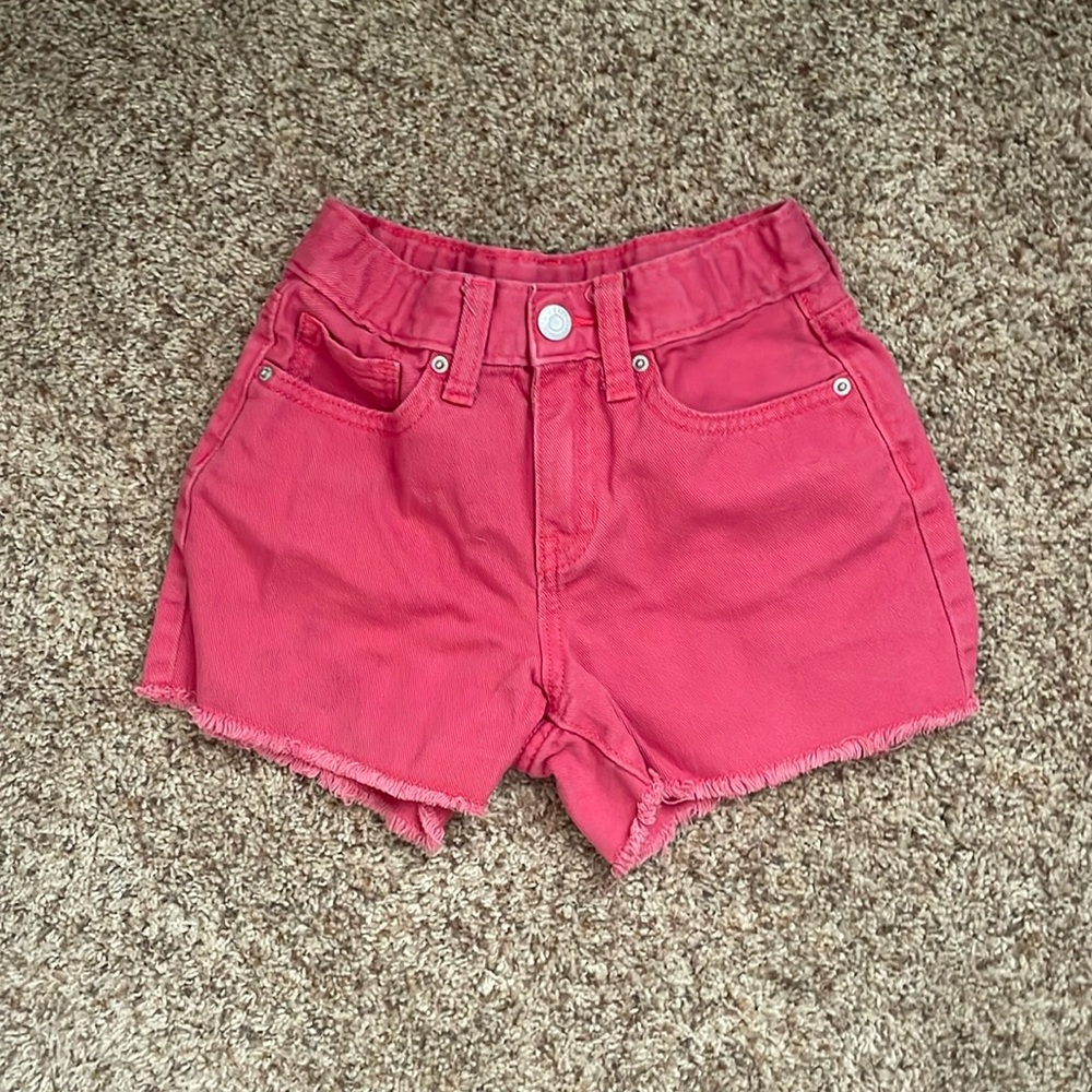 pink denim shorts.